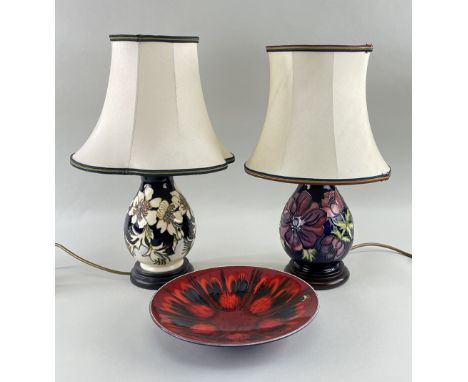 TWO MOORCROFT TABLE LAMPS &amp; POOLE DISH, lamps baluster form, hibiscus and anemone, 23cms, delphis dish 26.5cms diam. (3)