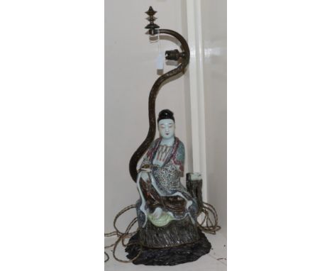 Metal table lamp with stained wooden base together with an Oriental figure 