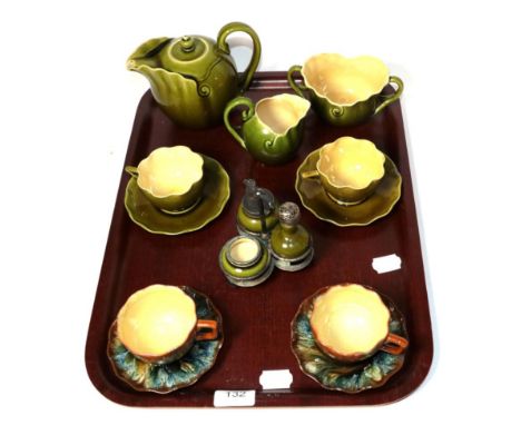 Linthorpe pottery: a three piece tea set numbers 1037, 1038 and 1039, a pair of tea cups and saucers number 1427 in a green g