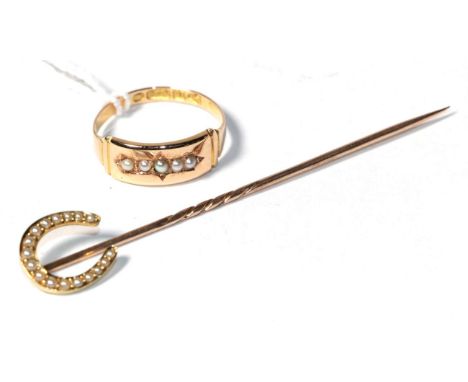 A 15 carat gold seed pearl ring, finger size N1/2; and an unmarked seed pearl horseshoe stick pin . Ring - 1.6 grams. Stick p