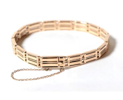 A gate link bracelet, stamped '10ct', length 18.5cm .  Gross weight - 19.92 grams. 