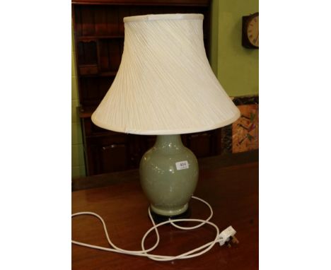 An Oriental celadon porcelain table lamp with incised decoration