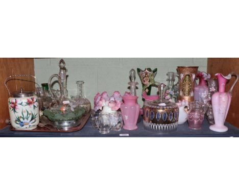 A shelf of Victorian and later coloured glass and two silver spoons 