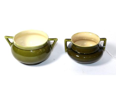 Christopher Dresser for Linthorpe pottery: a twin-handled green glazed sugar bowl number 763 and another number 637, each wit