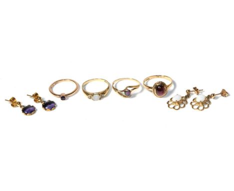 Three various 9 carat gold gem set rings, finger sizes L1/2, M1/2 and O; a gem set ring, stamped '9ct', finger size K1/2 a pa