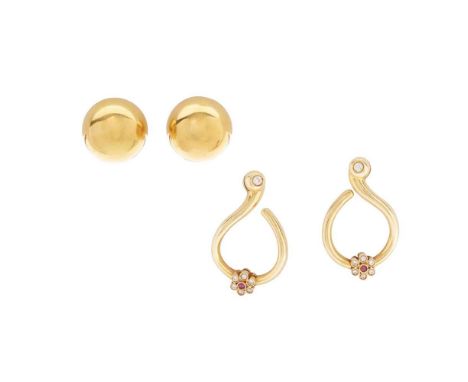 A pair of ruby and diamond earrings of open scrolling design set with small round-cut diamonds and rubies, post and butterfly