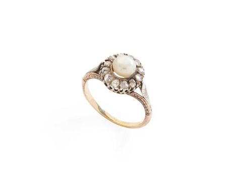 A pearl and diamond cluster ring set with an (untested) bouton pearl in a border of rose-cut diamonds, unmarkedDimensions:Rin