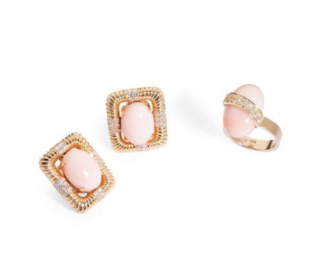 Y A pair of coral and diamond earrings each claw-set with an oval cabochon coral in a ribbed surround with small round-cut di