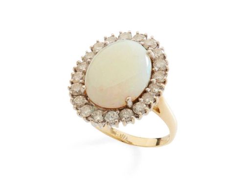 An opal and diamond cluster ring claw-set with an oval cabochon opal in a border of round brilliant-cut diamonds, modelled in