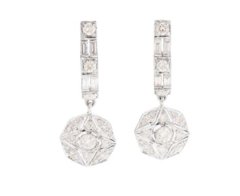 A pair of diamond pendent earrings each composed of a row of alternating round brilliant and baguette-cut diamonds, suspendin