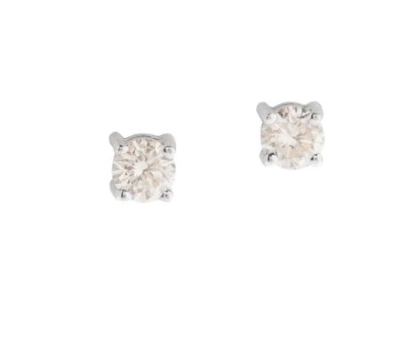 A pair of diamond stud earrings each claw-set with a round brilliant-cut diamond, post and butterfly fittings, unmarked