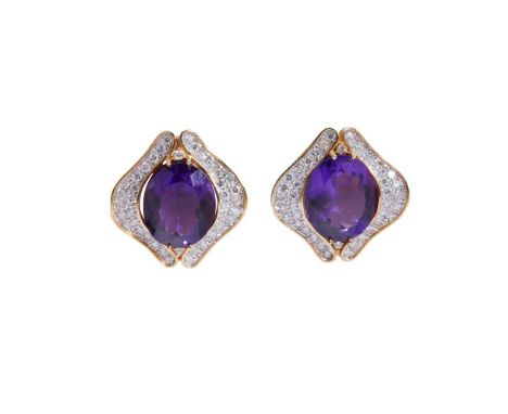A pair of amethyst and diamond earrings each claw-set with an oval-cut amethyst in a pavé-set border of round brilliant-cut d