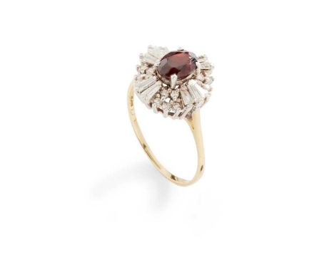 A garnet and diamond cluster ring claw-set with an oval-cut garnet, in a border of round brilliant and baguette-cut diamonds,