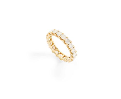 A diamond eternity ring claw-set with a row of round brilliant-cut diamonds, stamped 750Dimensions:Ring size: K