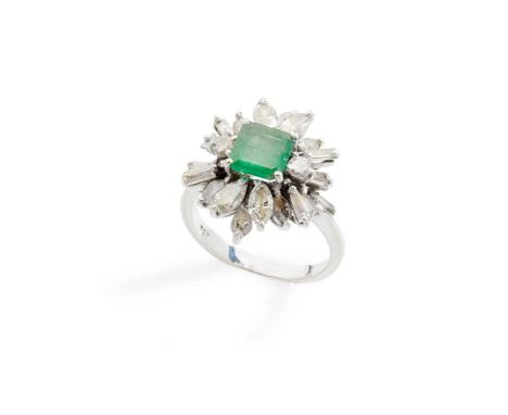 An emerald and diamond cluster ring claw-set with a cut-cornered square-cut emerald, in a border of round brilliant, baguette