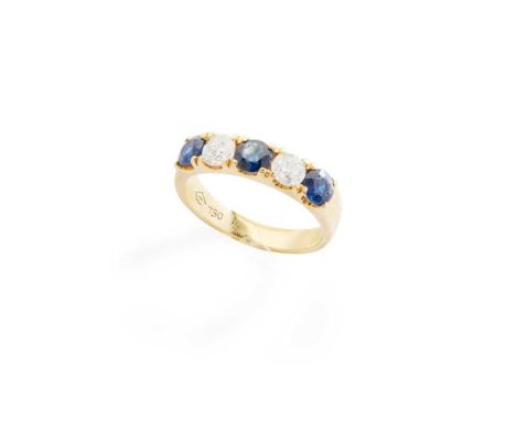 A sapphire and diamond ring claw-set with two round brilliant-cut diamonds and three round-cut sapphires, stamped 750Dimensio