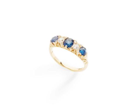 A sapphire and diamond ring claw-set with three cushion-cut sapphires and three old round-cut diamonds, diamond chip detail, 