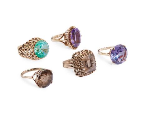 A collection of gem-set cocktail rings including a 9ct gold smokey quartz cocktail ring, and another in a raised rectangular 