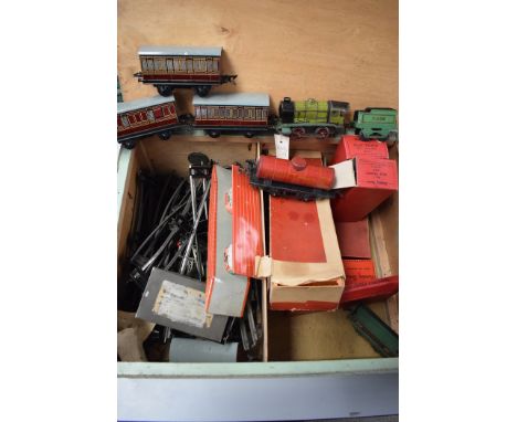 Hornby 0-gauge railway items, to include a tinplate 0-4-0 clockwork locomotive and associated tender; rolling stock to includ