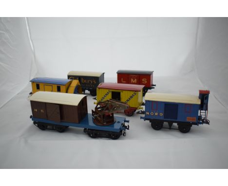 Hornby 0-gauge rolling stock, to include: rotary plough; ten-ton crane with Red Cross wagon; Cadburys Chocolates; Fyffes Bana