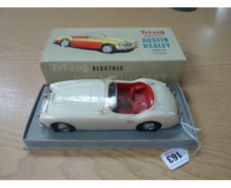 A BOXED TRI-ANG ELECTRIC PLASTIC BATTERY OPERATED AUSTIN HEALEY 100/6, 1/20 scale, not tested, missing both headlights and in