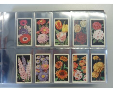 A CIGARETTE CARD ALBUM, loosely inserted, mixture of complete and incomplete sets issued by Carreras, to include 'Footballers
