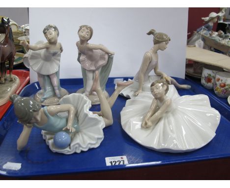 Nao Figurines, three seated Ballerinas and two standing, on circular bases (two with faults). (5)