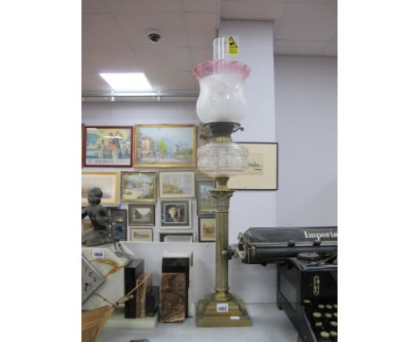 A Brass Oil Lamp, in the form of Corinthian Column, with glass funnel, shade glass well.