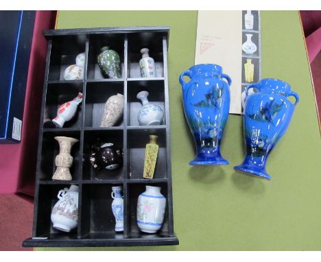 Franklin Mint 'The Treasures of The Imperial Dynasties', miniature vase collection in a hardwood display shelf, together with