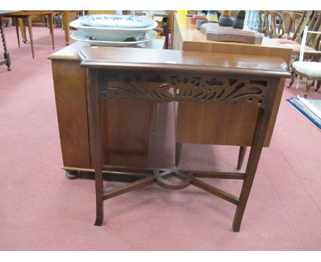 A Mahogany Console Table, with a pierced fretwork frieze on shaped square supports, united by stretchers, 83cm wide.