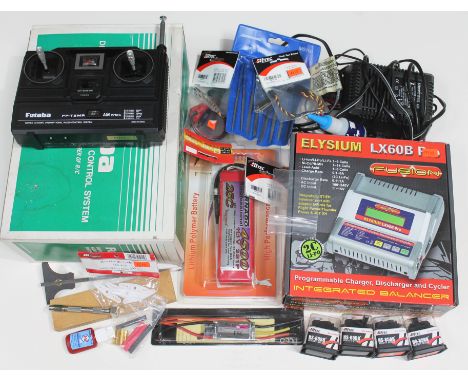 RC model accessories including a Futabo FP-T2MR controller, an Elysium LX60B Pro charger, a fullymax lithium batter, four HiT