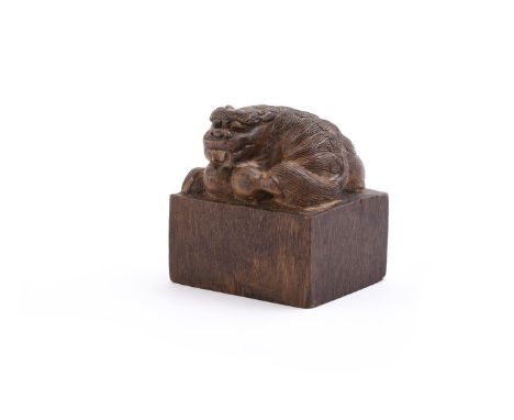 A Chinese wood 'Buddhist' lion seal, possibly aloeswood, with distinctive smell to wood, carved seal, 5.2cm high x 5cm long x