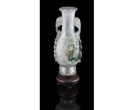 A Chinese green hardstone 'Dragon' vase, circa 1950, with spinach green, brown and white inclusions, well carved with chilong