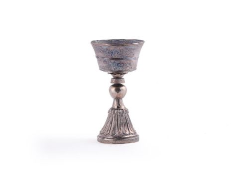 A Tibetan silver Butter Lamp, 19th century, revolving in three parts, 23cm high  Provenance: By repute collected by the curre