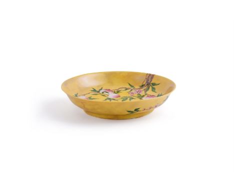 A Chinese yellow- ground 'peach and bat' dish, 20th century, the yellow with brown staining in the glaze, apocryphal six char