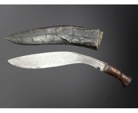 A Gurkha kukri knife in sheath.