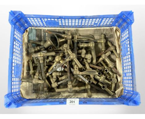 A crate of vintage brass door handles 