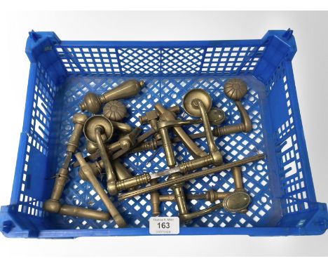 A crate of vintage brass door handles various 