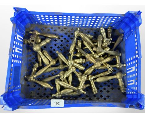 A crate of vintage brass door handles 
