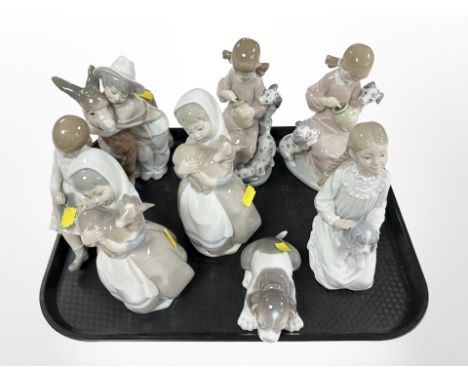 Eight various Lladró and Nao figures and figure groups, tallest 21cm.