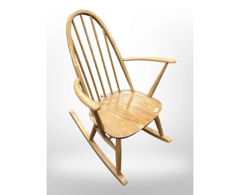 An Ercol elm and beech spindle back rocking chair (splits to back rest) 