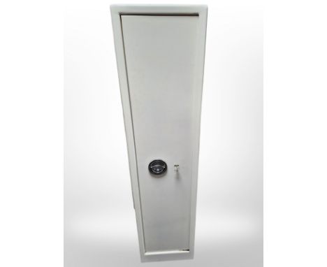 A steel gun cabinet with slots for five guns plus ammunition storage above, with two keys, 35 cm x 30 cm x 145 cm 