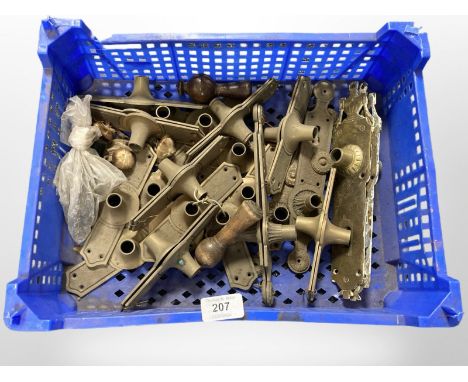 A crate of vintage brass door plates 