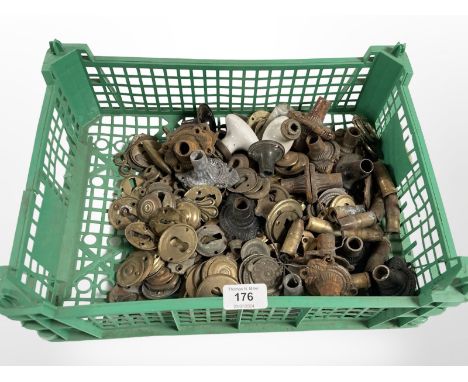 A crate of vintage brass and metal door handle collars, escutcheons etc 