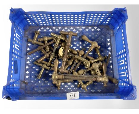 A crate of vintage brass door handles 