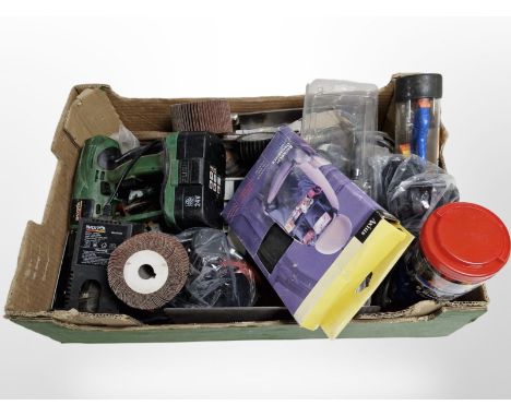 A box of various power and hand tools, bungee cords, etc.