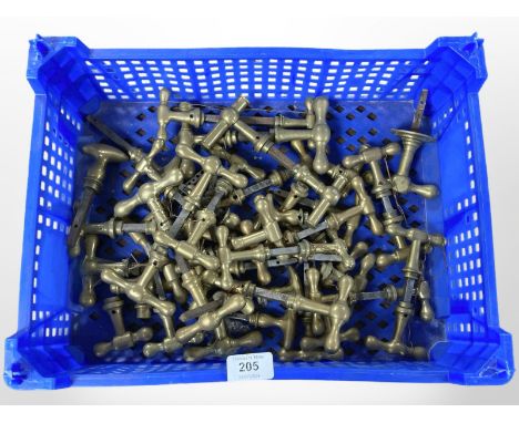 A crate of vintage brass door handles 