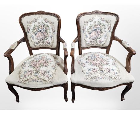 A pair of continental carved salon armchairs in tapestry fabric, width 66 cm 