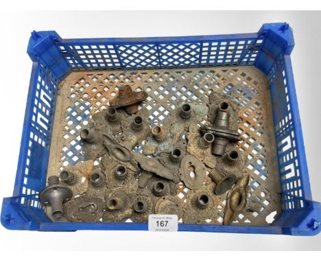 A crate of vintage metal door handle collars 