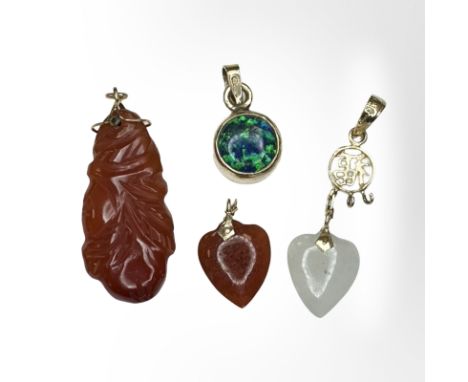 Four gold mounted jade and opal pendants (4)